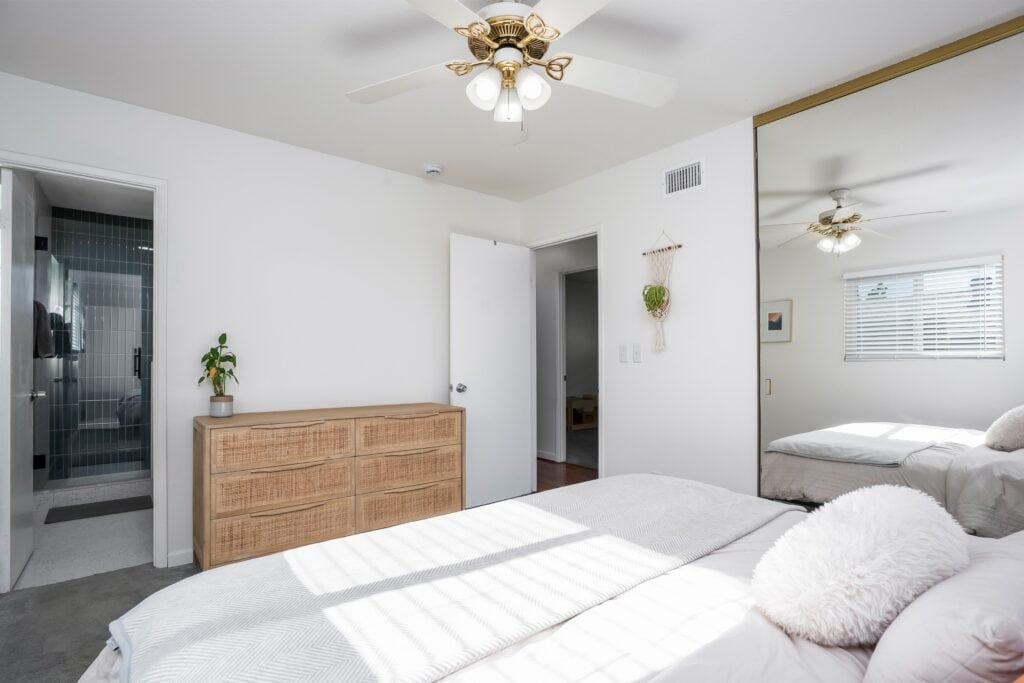 Spacious primary suite at 2170 Montclair St in North Park San Diego with views into the attached newly remodeled bathroom.