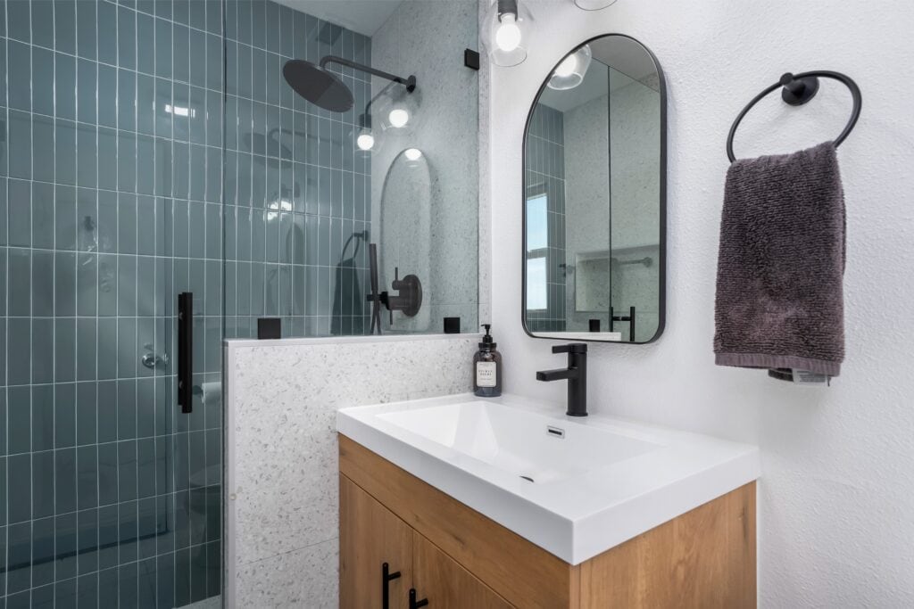 Detail view of a modern white sink and matte black faucet at 2170 Montclair St, showing the high-end finishes in this North Park