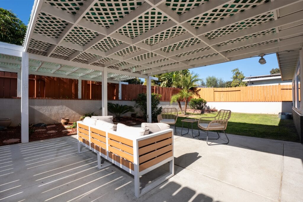 Architecturally designed outdoor living space at 2170 Montclair St, displaying a weather-protected pergola and drought-tolerant landscaping in a quiet North Park pocket.