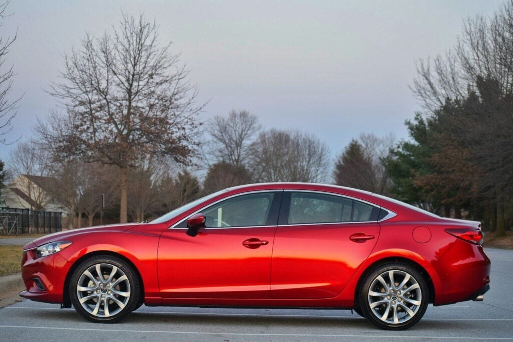 Почему пинается АКПП у Mazda 6: 9 причин толчков и способы ремонта 1 a red car parked on a street