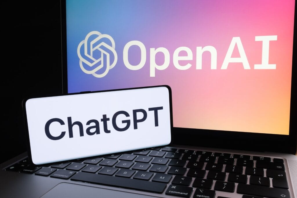 "Laptop screen displaying the OpenAI logo with a smartphone showing the ChatGPT logo, symbolizing AI-powered language models and OpenAI’s advancements in AI technology.