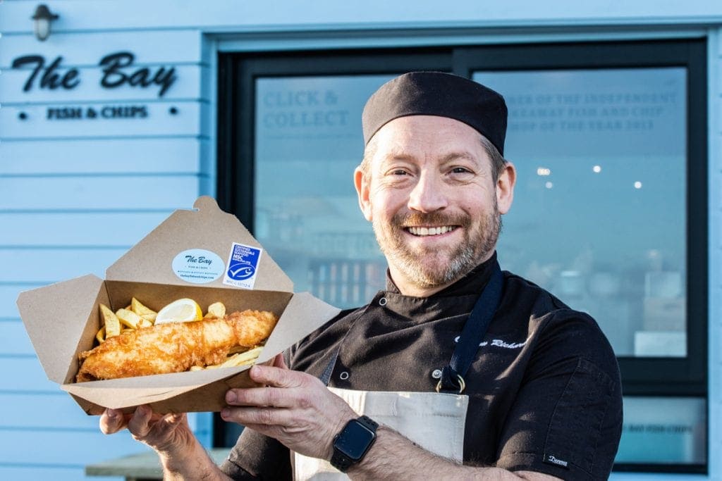 The Bay Fish and Chips - Calum the owner with fish and chips box