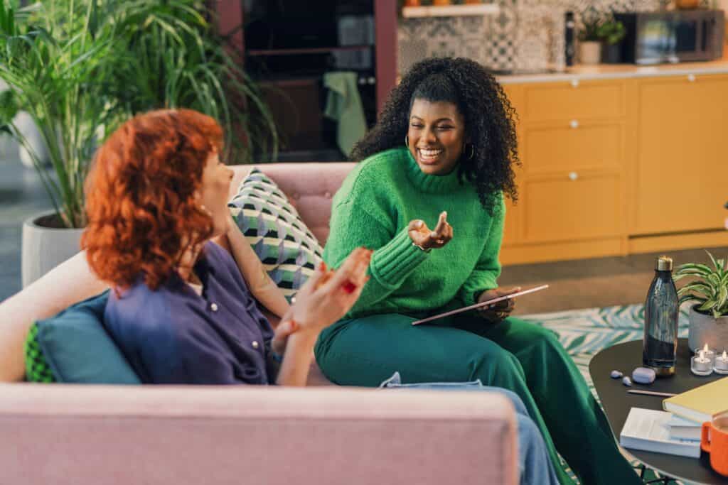 Individual consultation for new managers and clinical supervisors occurring face-to-face on a couch.