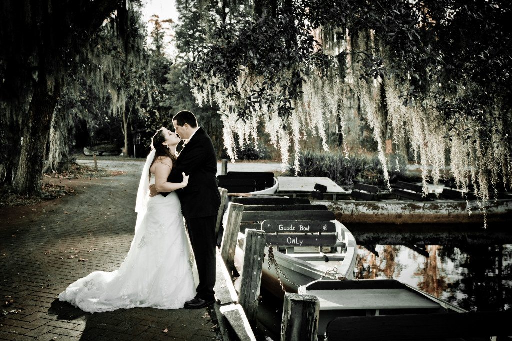 black and white photo of married couple under an oak tree