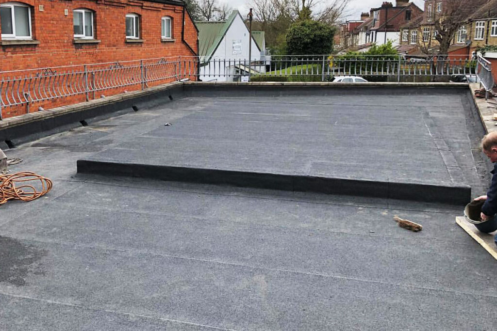 Our roofing contractors replaced flat roof using felt materials in London.