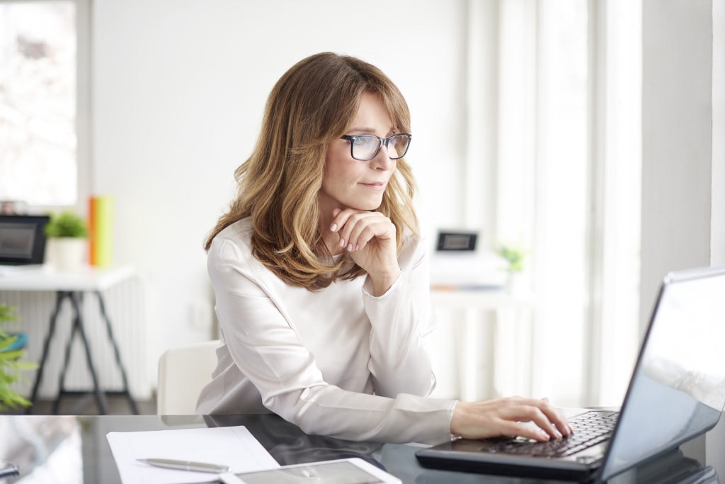Private Personal Assistant Working At Desk