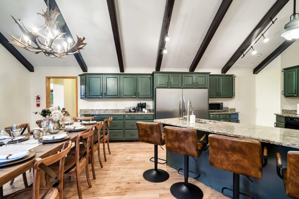 A gourmet kitchen with a full dining table and counter seating, room to cook and gather at once.
