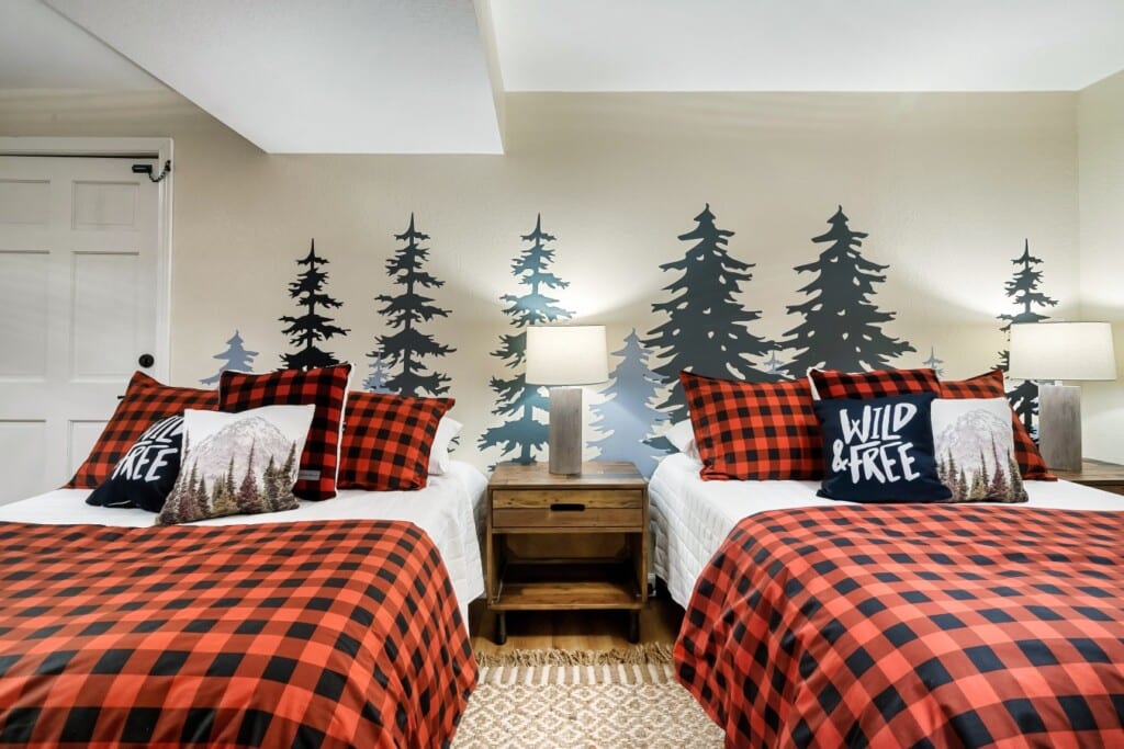Lower-level bedroom: two full beds, Murphy bed, and a 42-inch TV. Flexible for the however your group splits up.