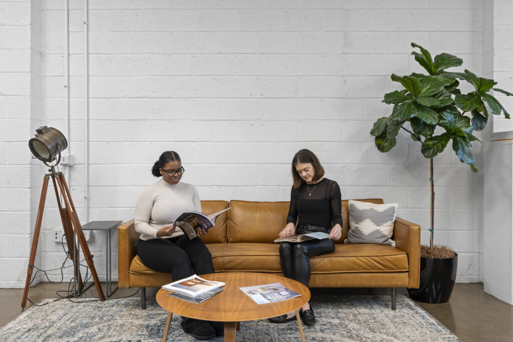 Two women sitting on a couch