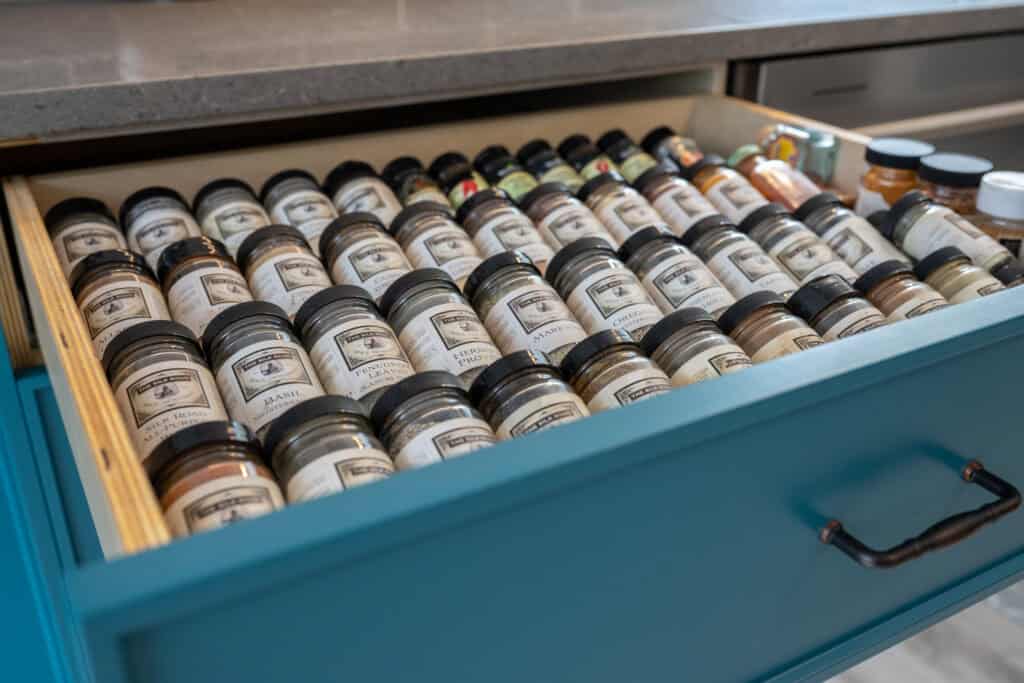 A soft close kitchen drawer showing well thought-out storage solutions. Kitchen cabinetry with exceptional, high-quality results