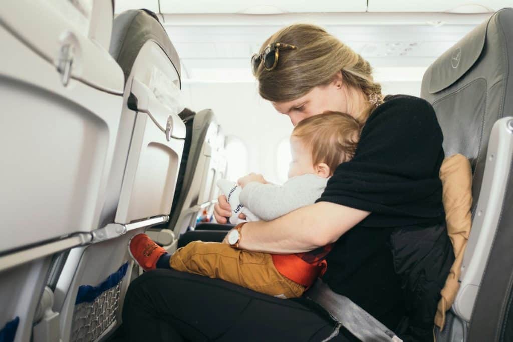 Woman flying with a young child 
