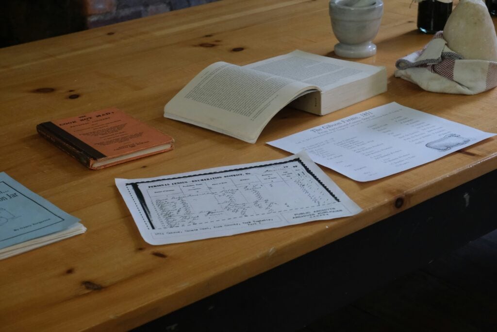 Business planning checklist showing marketing versus systems strategy on clipboard next to laptop