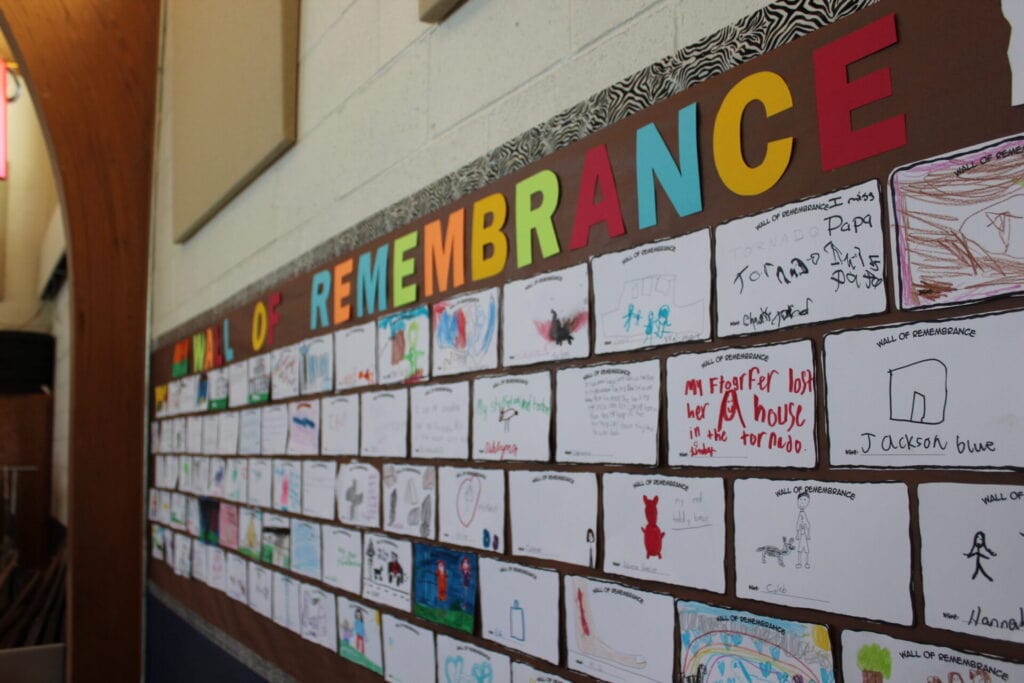 Martin Luther School gym in Joplin, Missouri serving as a community wall of remembrance in summer 2011, where children and families drew and wrote messages of hope and healing after the EF5 tornado