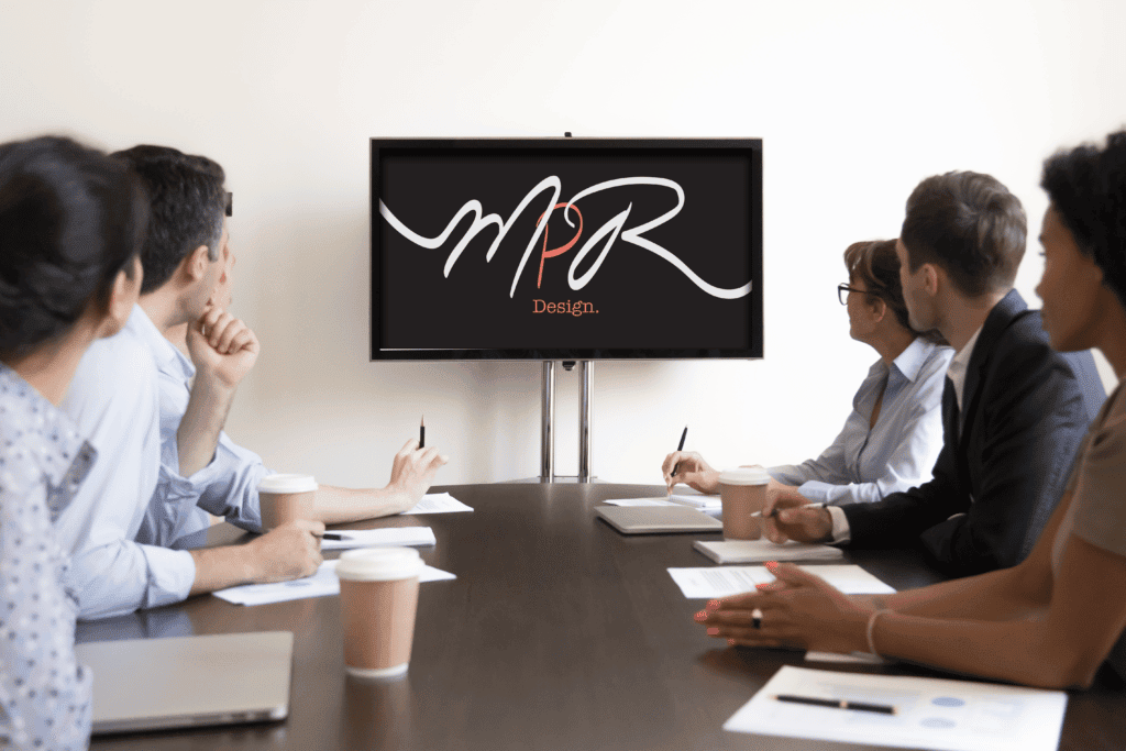 meeting of people watching a presentation