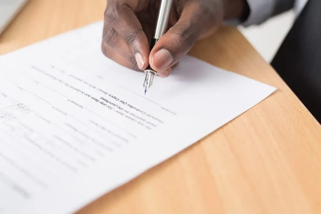 man writing contract for multiboard 7.0 article