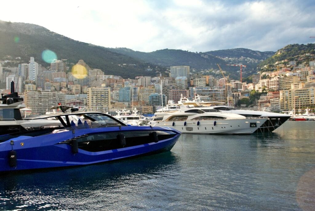 A Seaport with Yachts and Buildings in the Background