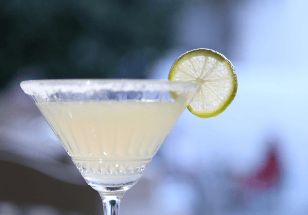 Signature cocktail with fresh lime served at Nautilus Mykonos bar — best cocktails in Mykonos restaurant nightlife.