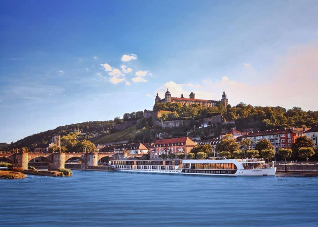 Rhine River cruise showcasing historic castle and lush landscape.
