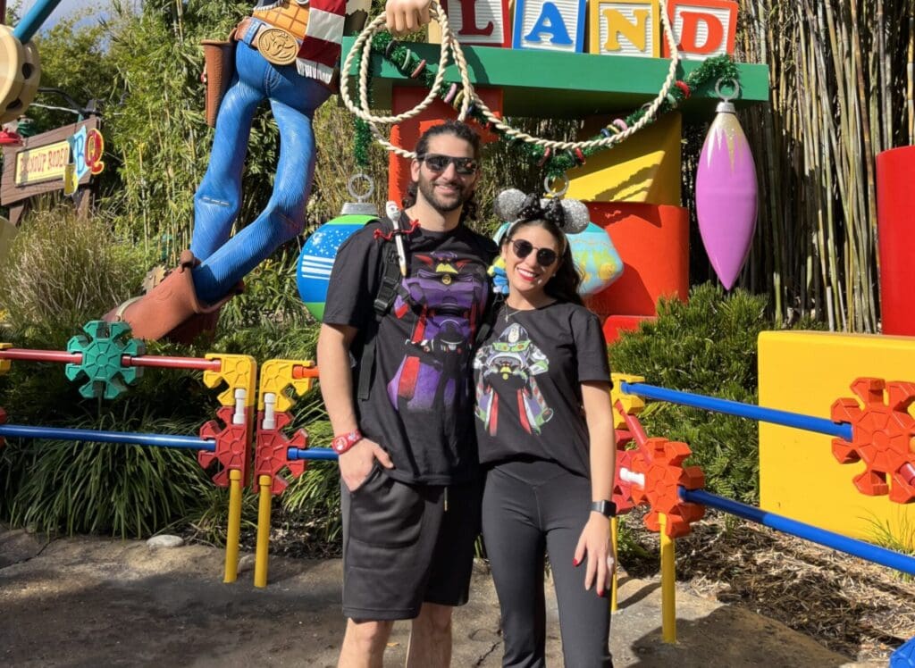 Toy Story Land entrance featuring Woody and colorful decorations.
