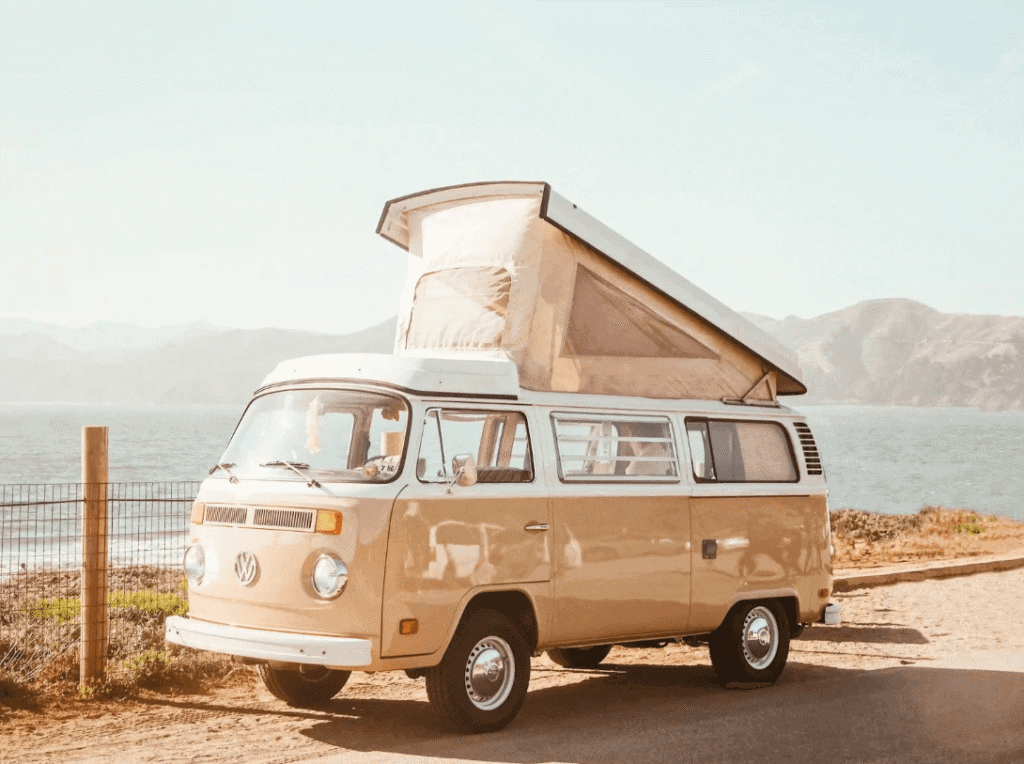 camping van in front of the ocean