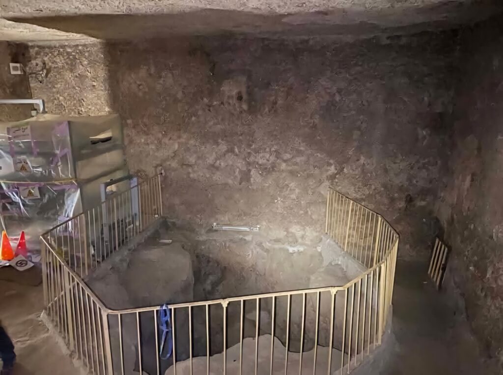 Archaeologists exploring a newly discovered passageway inside the Great Pyramid of Giza, uncovering hidden chambers.