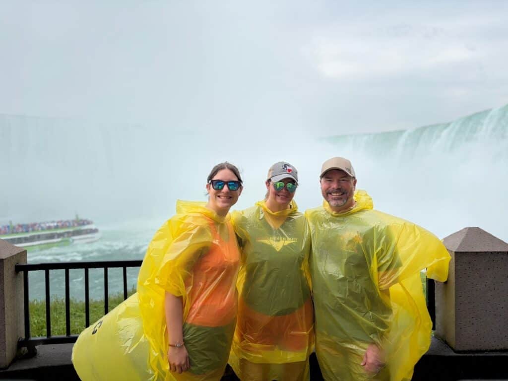Group of friends in yellow rain ponchos at Niagara Falls.