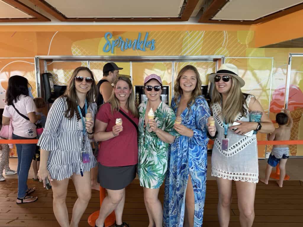 Ice cream enjoying women on vacation at Sprinkles ice cream shop, tropical themed vacation with friends, summer fun, Orlando vacation.