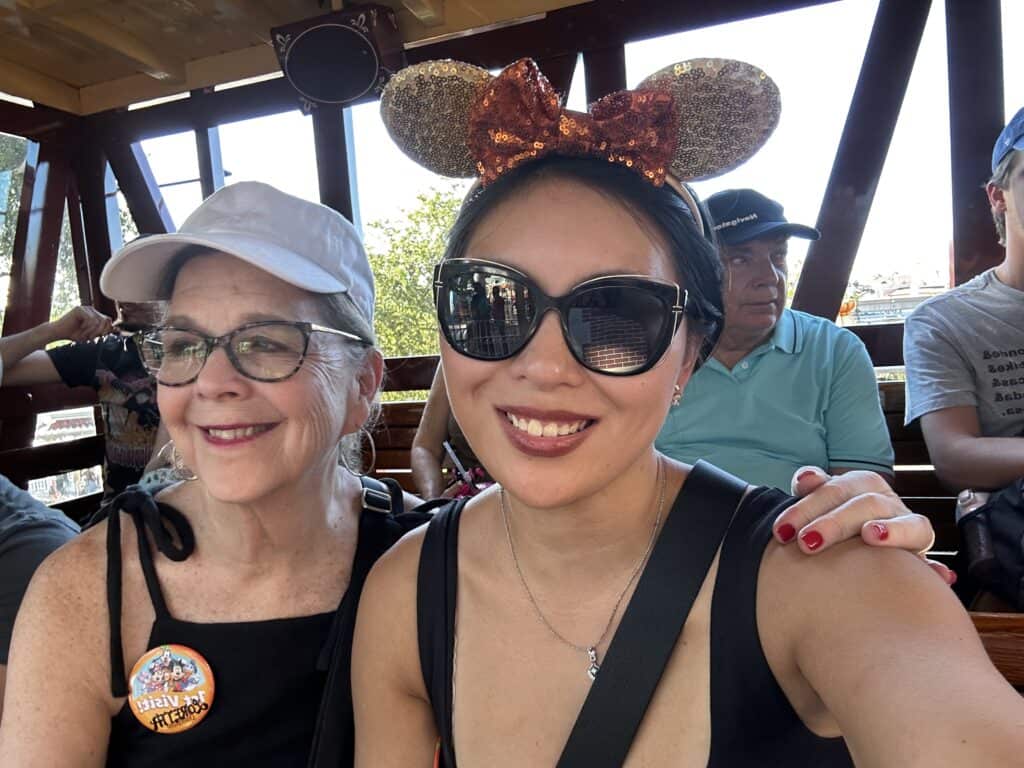 Enjoying a scenic boat ride with friends, featuring festive accessories and beautiful views.