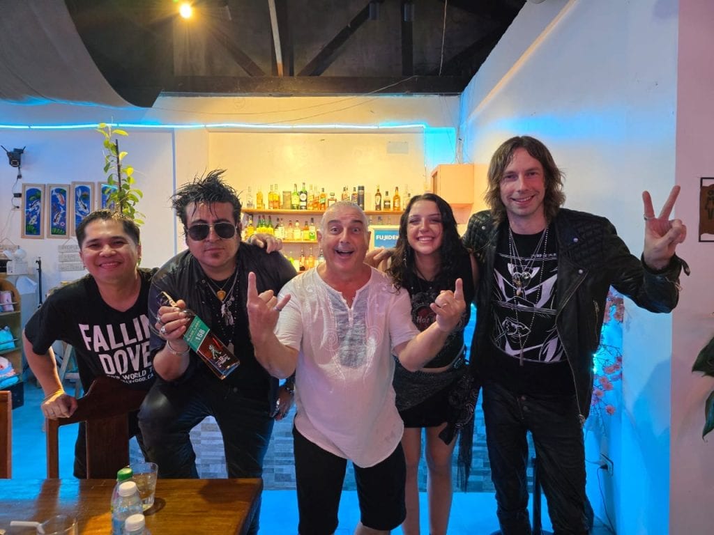 The Falling Doves, with band manager pose in black with Tim Bennett From The Argonettes