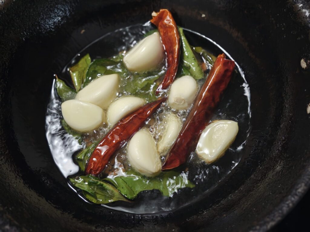 Pulikaachal eSaute ingredients with garlic and chilly
