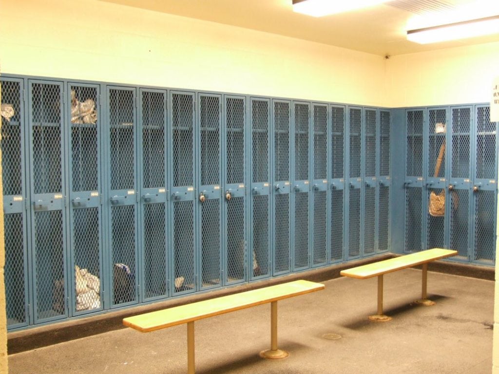 blue lockers with two benches in front