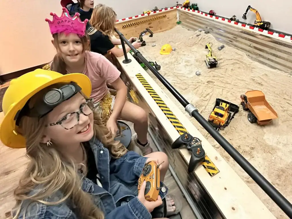 Children operating RC construction equipment in the Dig Zone