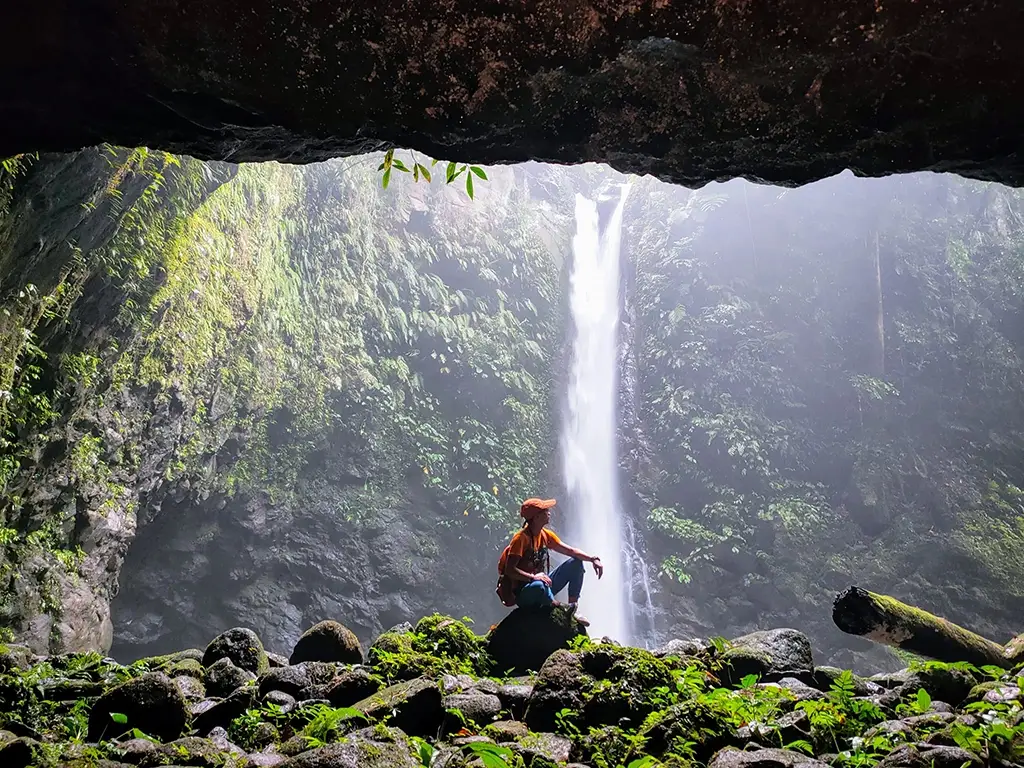 A picture of someone enjoying the Casaroro Falls in solitude.