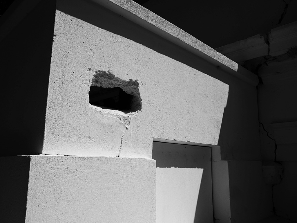 Old white washed building. Old Cromwell Town NZ. B&W