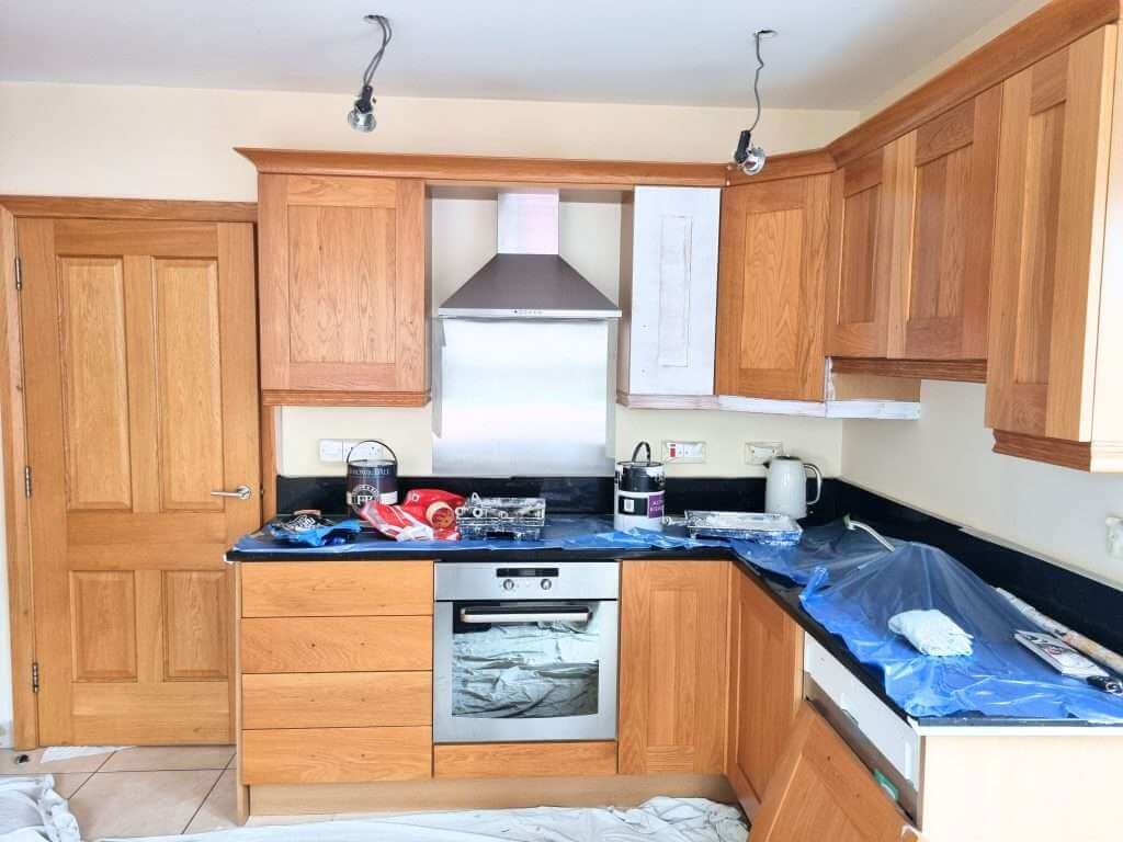 Wooden kitchen cabinets with modern appliances installation