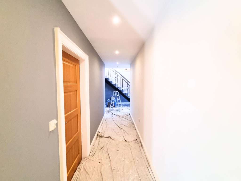 Hallway with ladder and protective floor covering Hallway and protective floor covering in bushmills