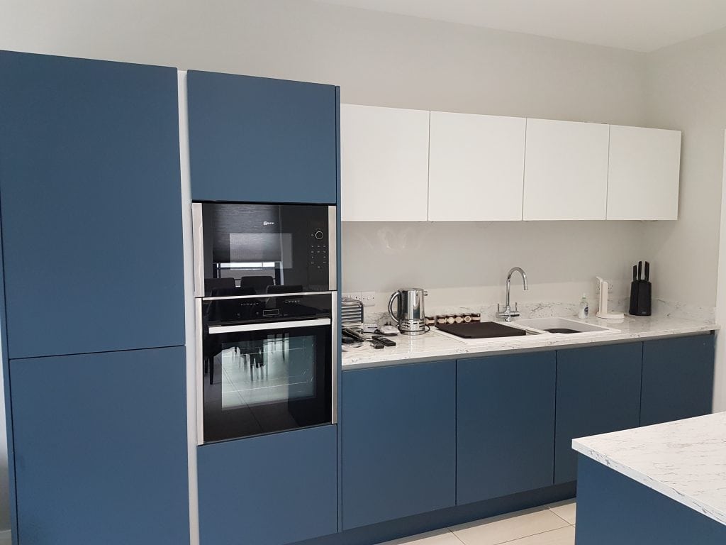 Modern kitchen interior design with blue cabinets