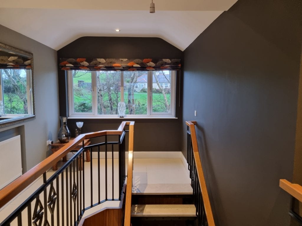 Hallway with natural tones with large window