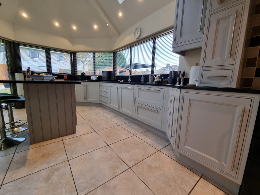 Gray hand painted kitchen cupboards in coleraine