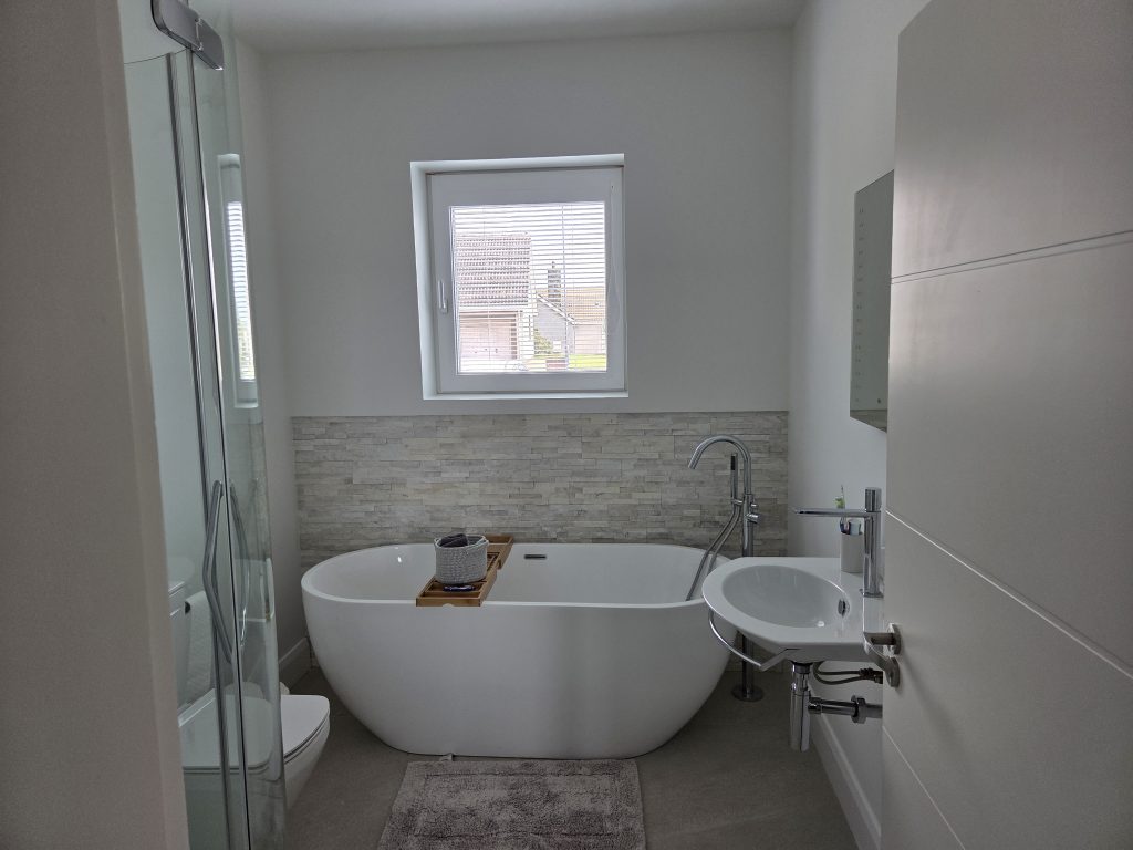 Modern bathroom with freestanding tub and shower