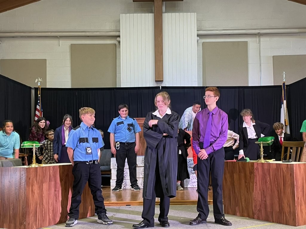Order in the Court cast members at Martin Luther School