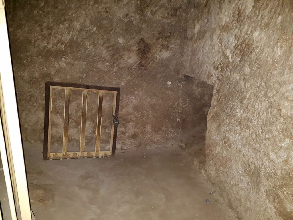 Archaeologists exploring a newly discovered passageway inside the Great Pyramid of Giza, uncovering hidden chambers.