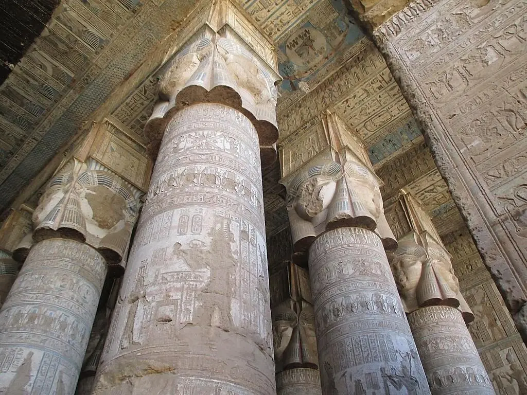 Hathor-headed capitals beneath a decorated ceiling