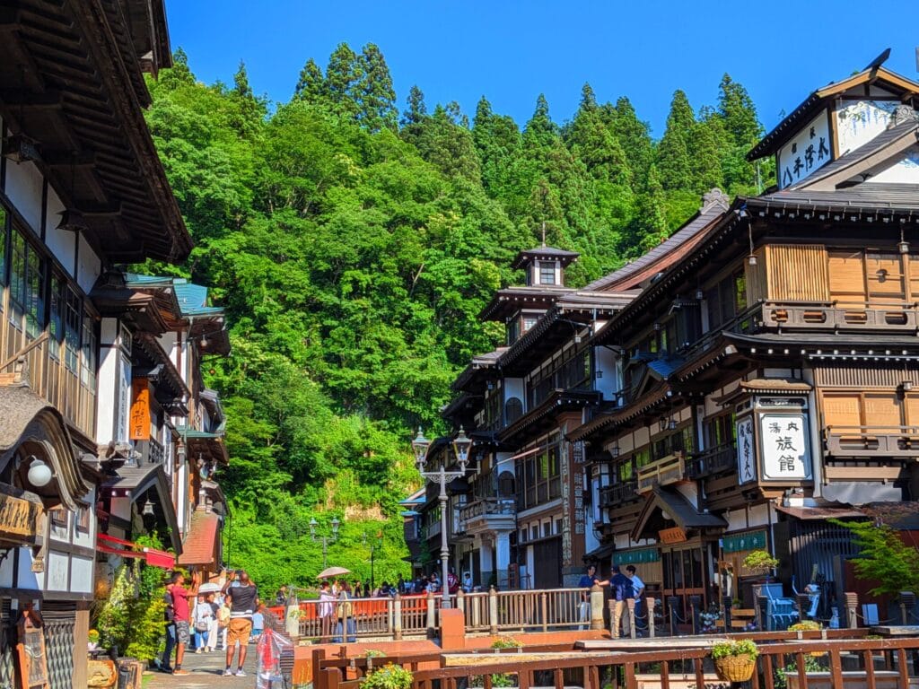 Ginzan Onsen town covered in snow, historic ryokans at night, JR Pass access