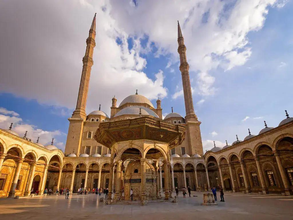 Wide courtyard view with domes and minarets at Cairo Citadel