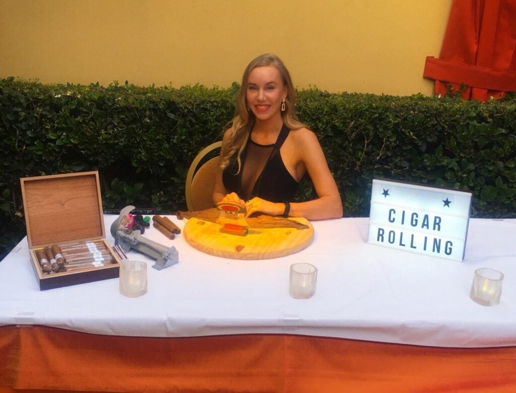 Cigar roller Dallas event station with female cigar roller for weddings, galas, and corporate activations