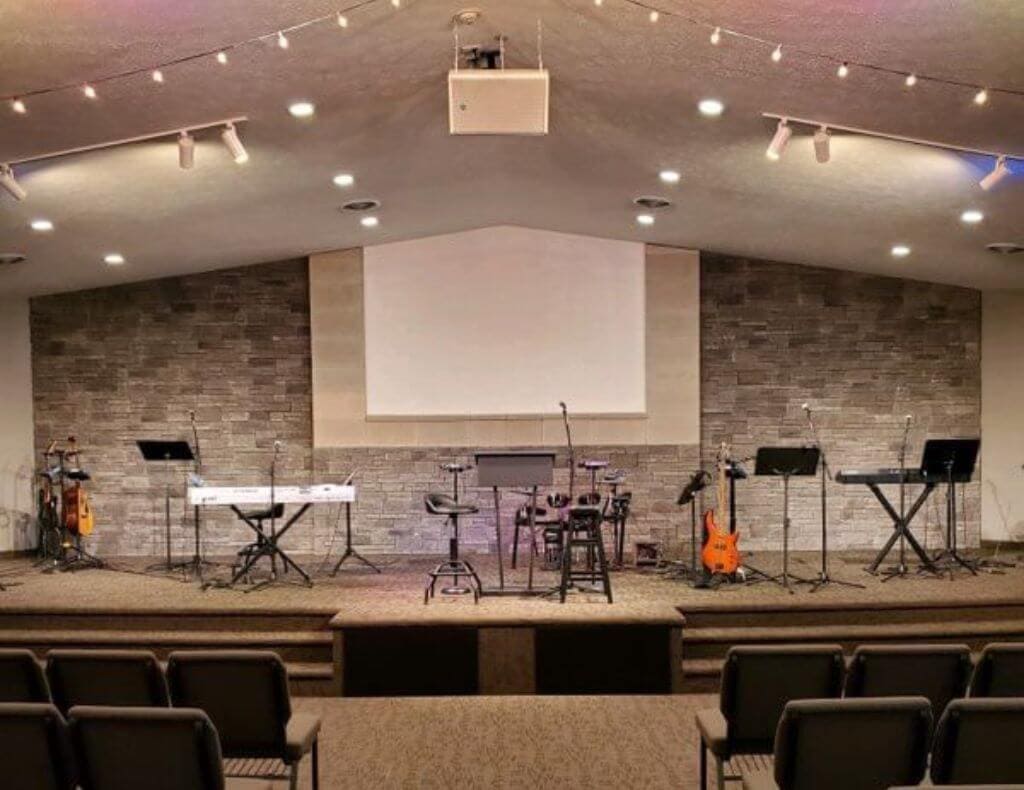 grey cultured stone church with light gray cultured stone