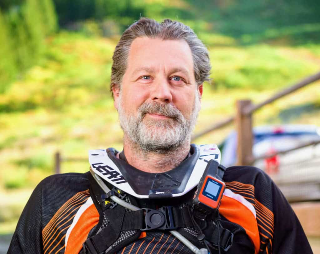 motorcycle rider with neck brace and Garmin inreach