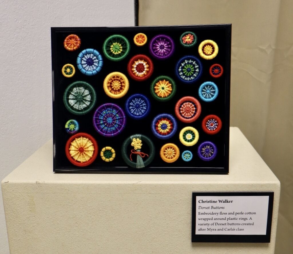 Black frame with rainbow circular buttons 