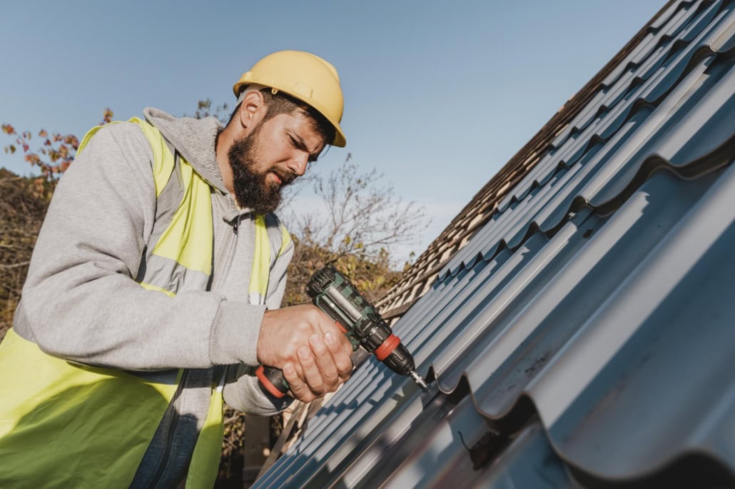 A licensed roofer working on the repair of a roof. Get in touch with us today to get your free estimate.
